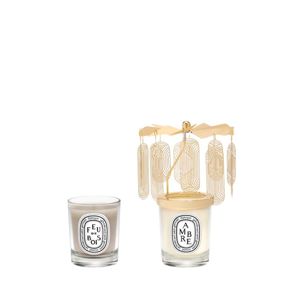 Diptyque Gold Carousel candle set. Gold petals spin and sparkle by candlelight.